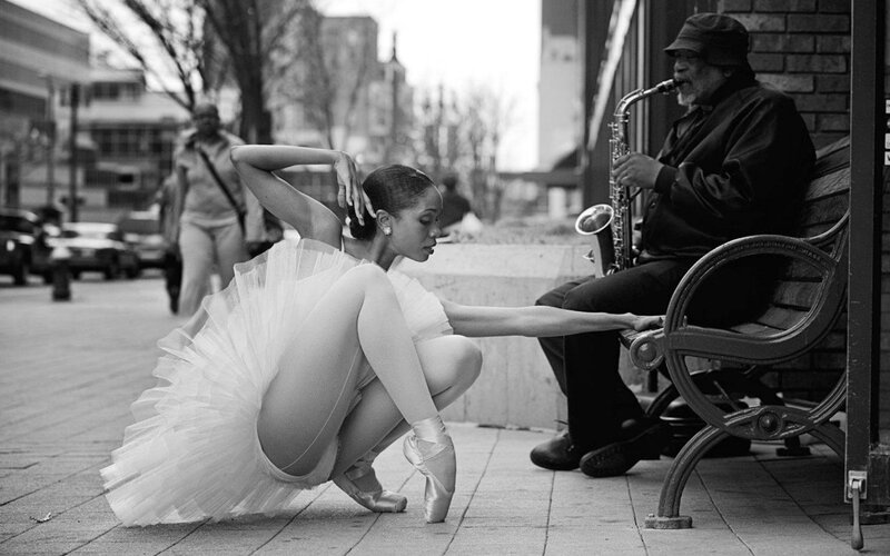 Ballerina and saxophonist on street