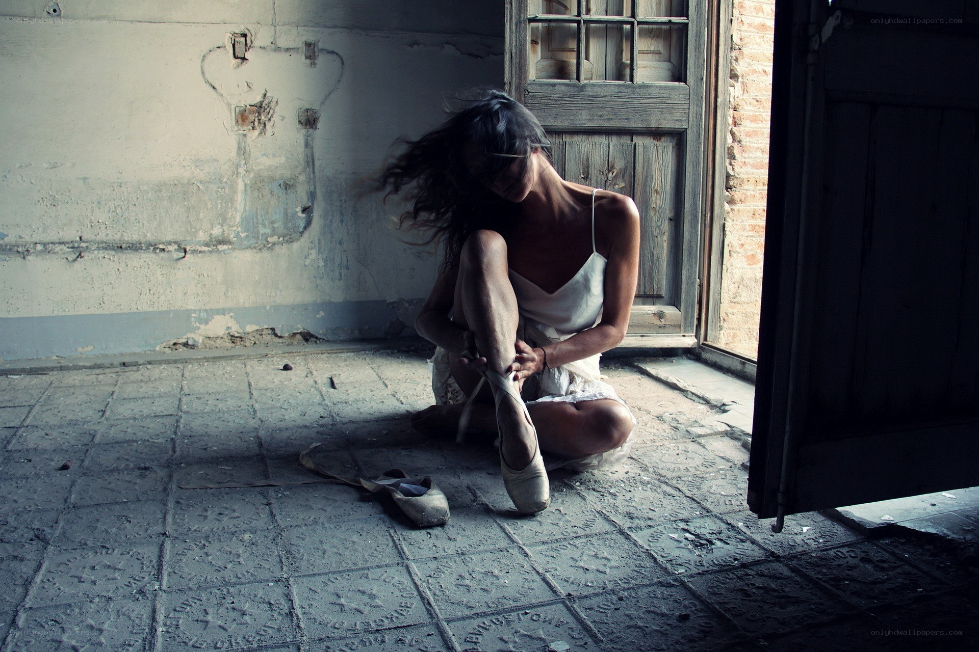 Ballerina in an abandoned room