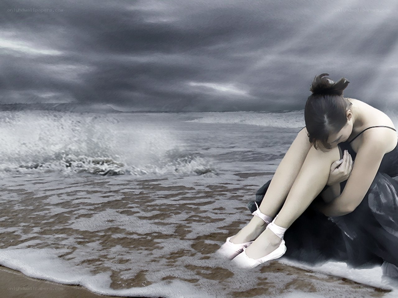Ballerina on stormy beach