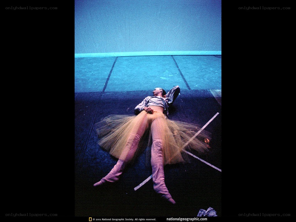 Ballerina resting on stage