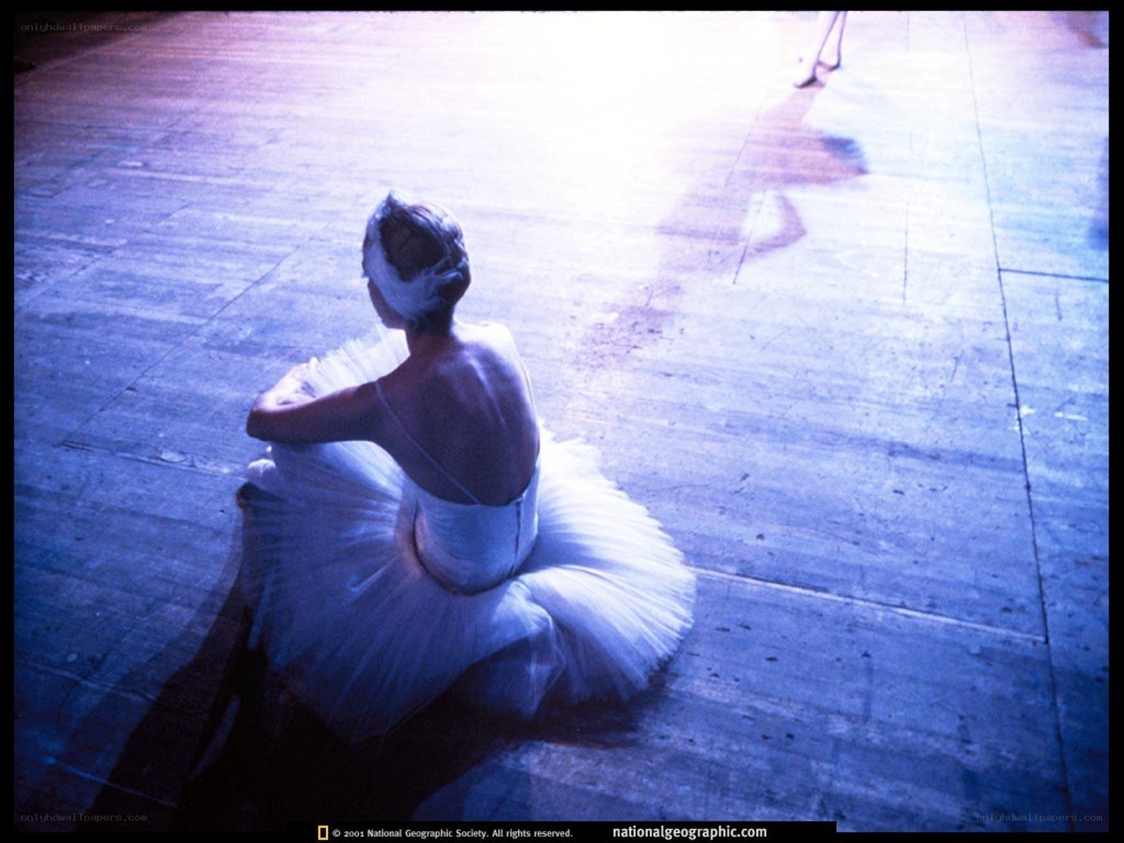 Ballerina sitting on stage