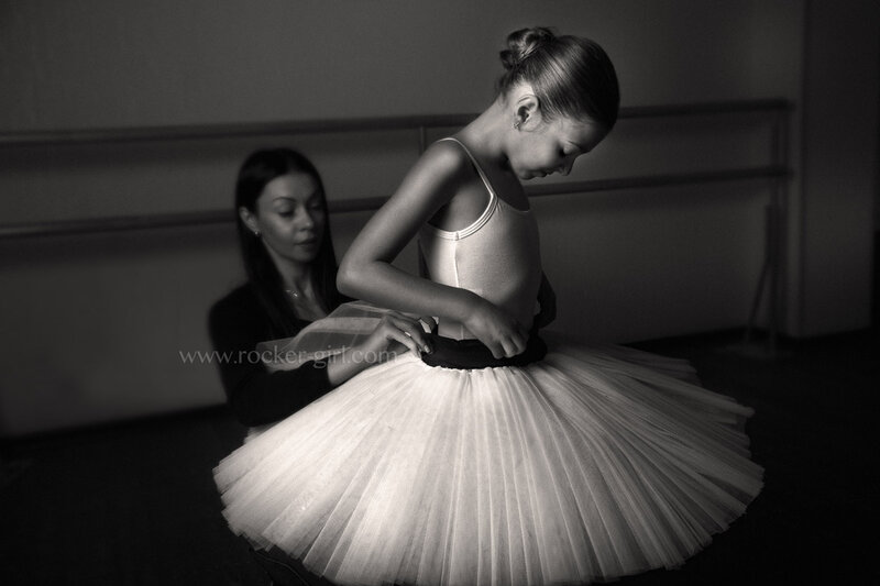 Ballet Dancer Adjusting Tutu