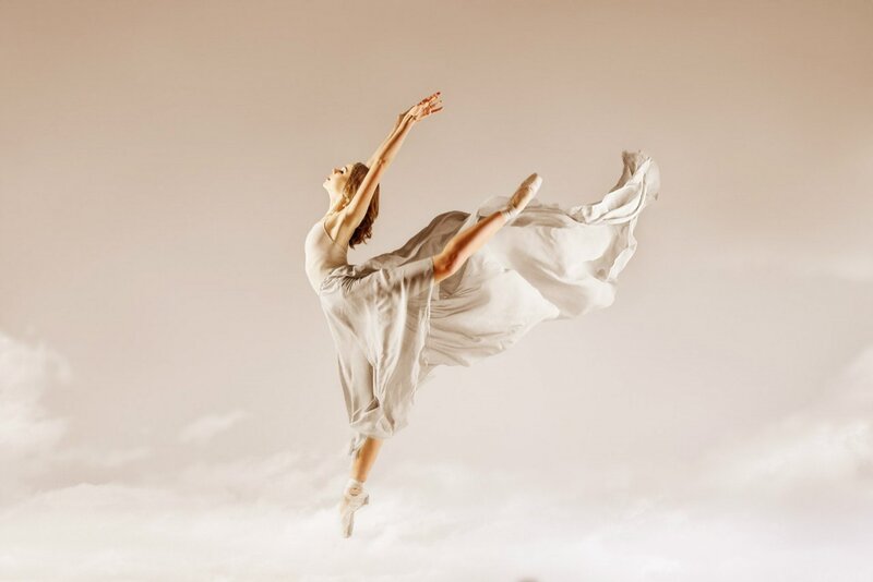 Ballet Dancer in Mid-air — White, Graceful, Photograph