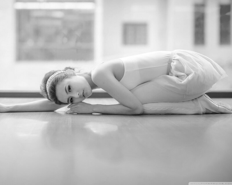 ballet dancer resting on floor
