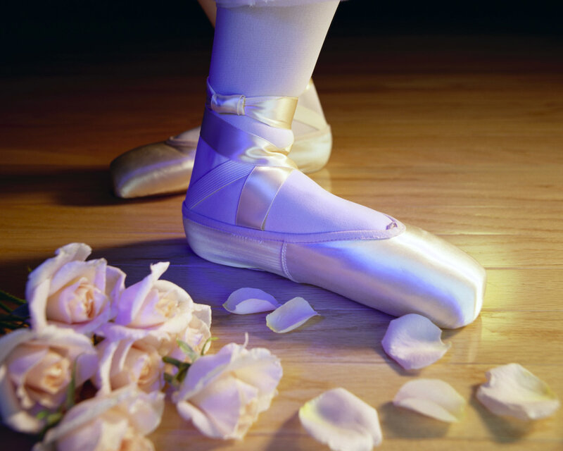 ballet dancer's feet with roses