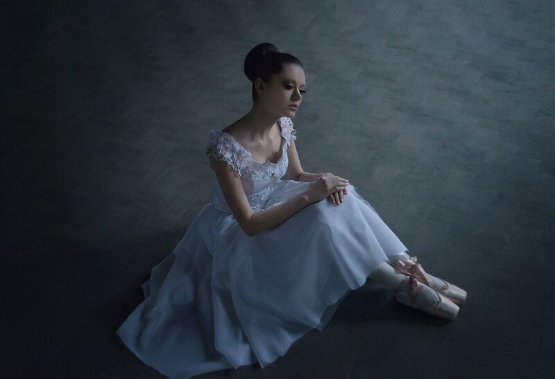 Ballet Dancer Sitting — White, Dramatic, Photograph