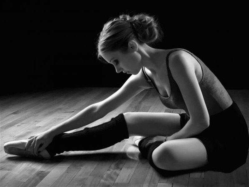 Ballet Dancer Stretching — Black, Dramatic