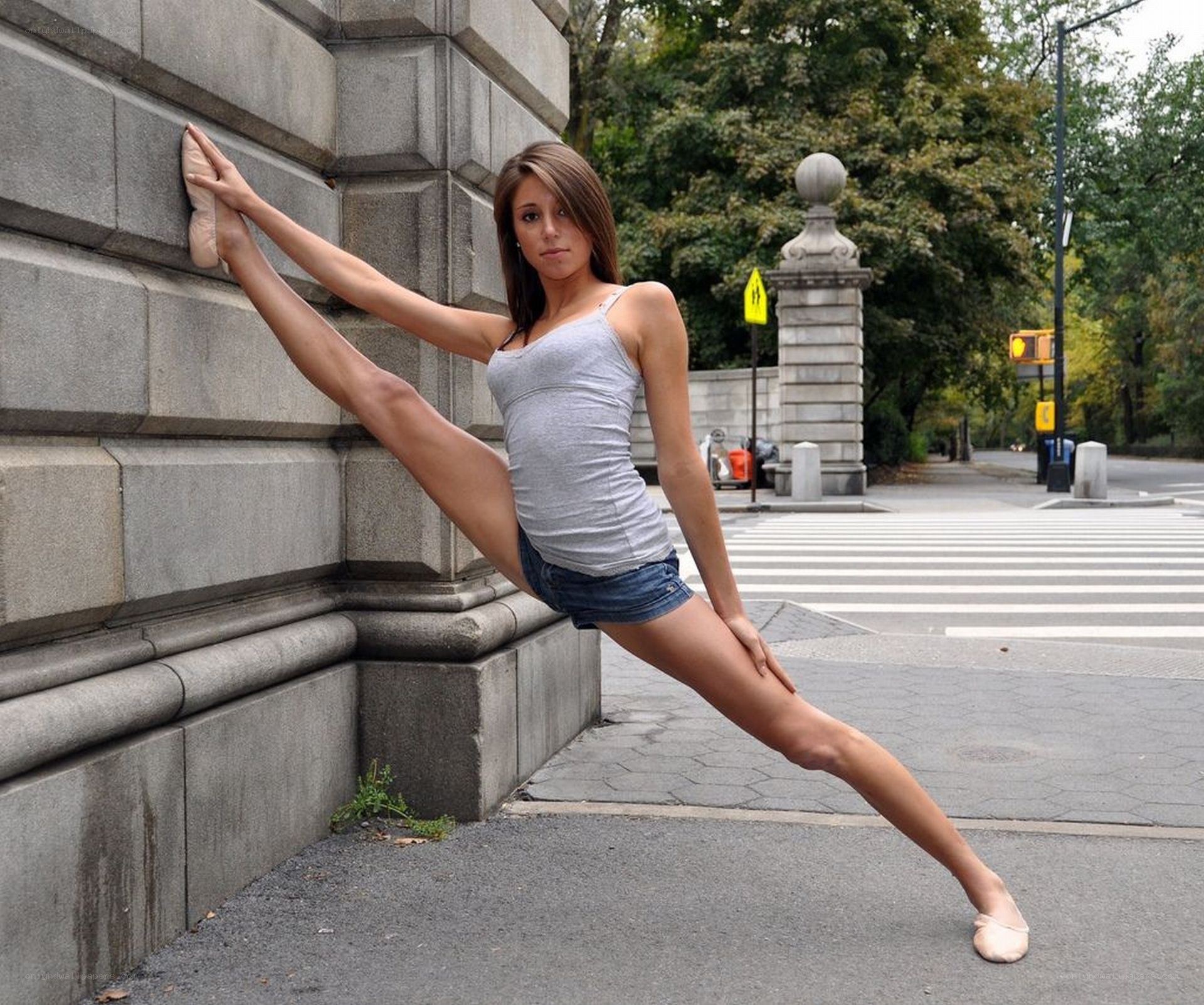 ballet dancer stretching on street