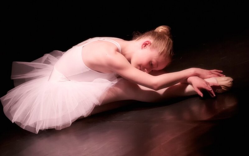 Ballet Dancer Stretching — White, Dramatic, Photograph