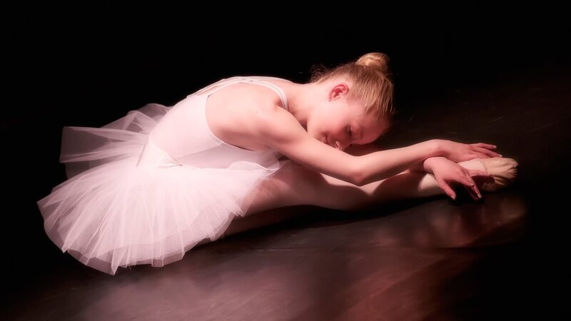 Ballet Dancer Stretching — White, Dramatic