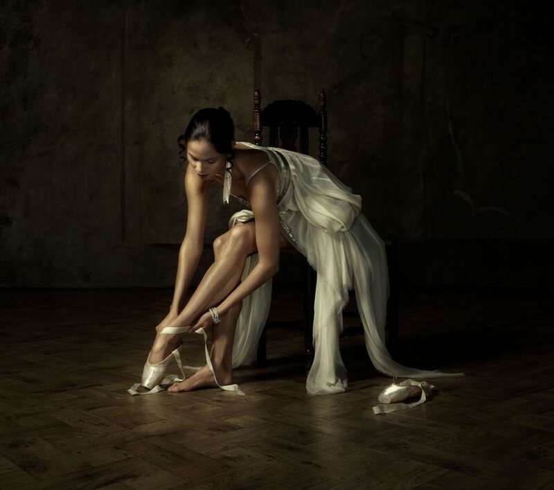 Ballet Dancer Tying Shoes — White, Dramatic, Photograph, Dress