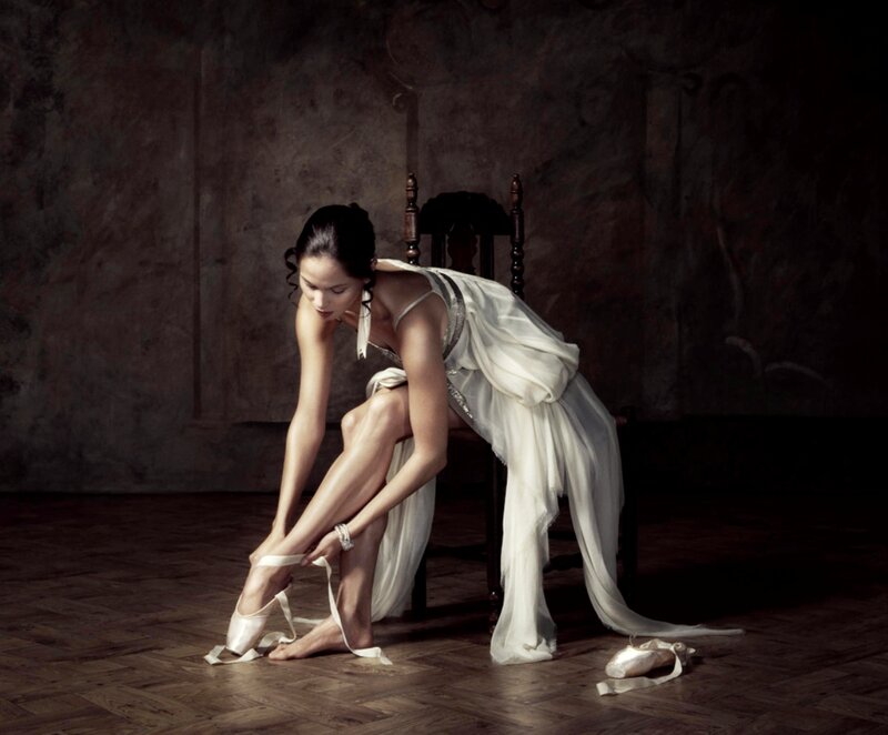 Ballet Dancer Tying Shoes — White, Dramatic, Photograph