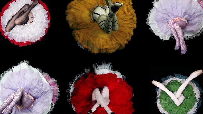 ballet dancers in colorful tutus