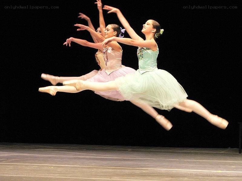 Ballet dancers in mid-jump