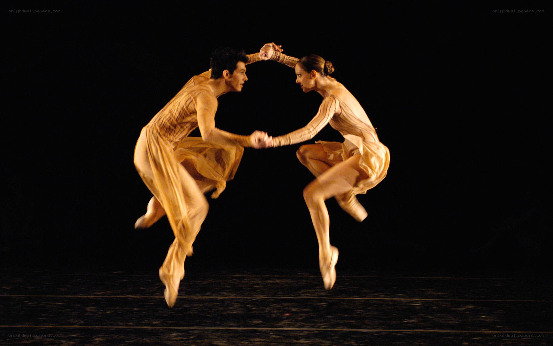Ballet dancers in mid-jump