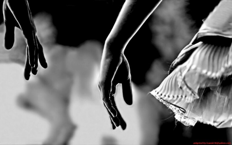 ballet dancers reaching hands