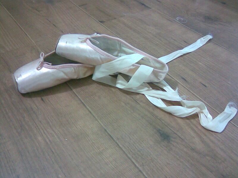 Ballet pointe shoes on floor
