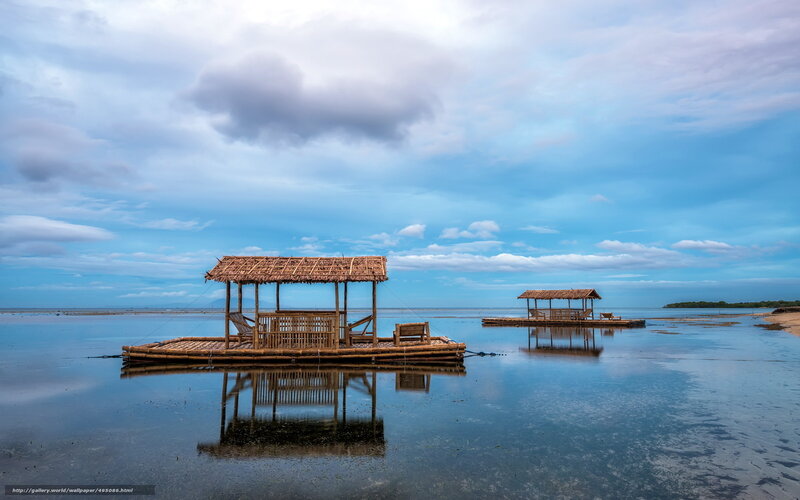 Bamboo huts on calm water