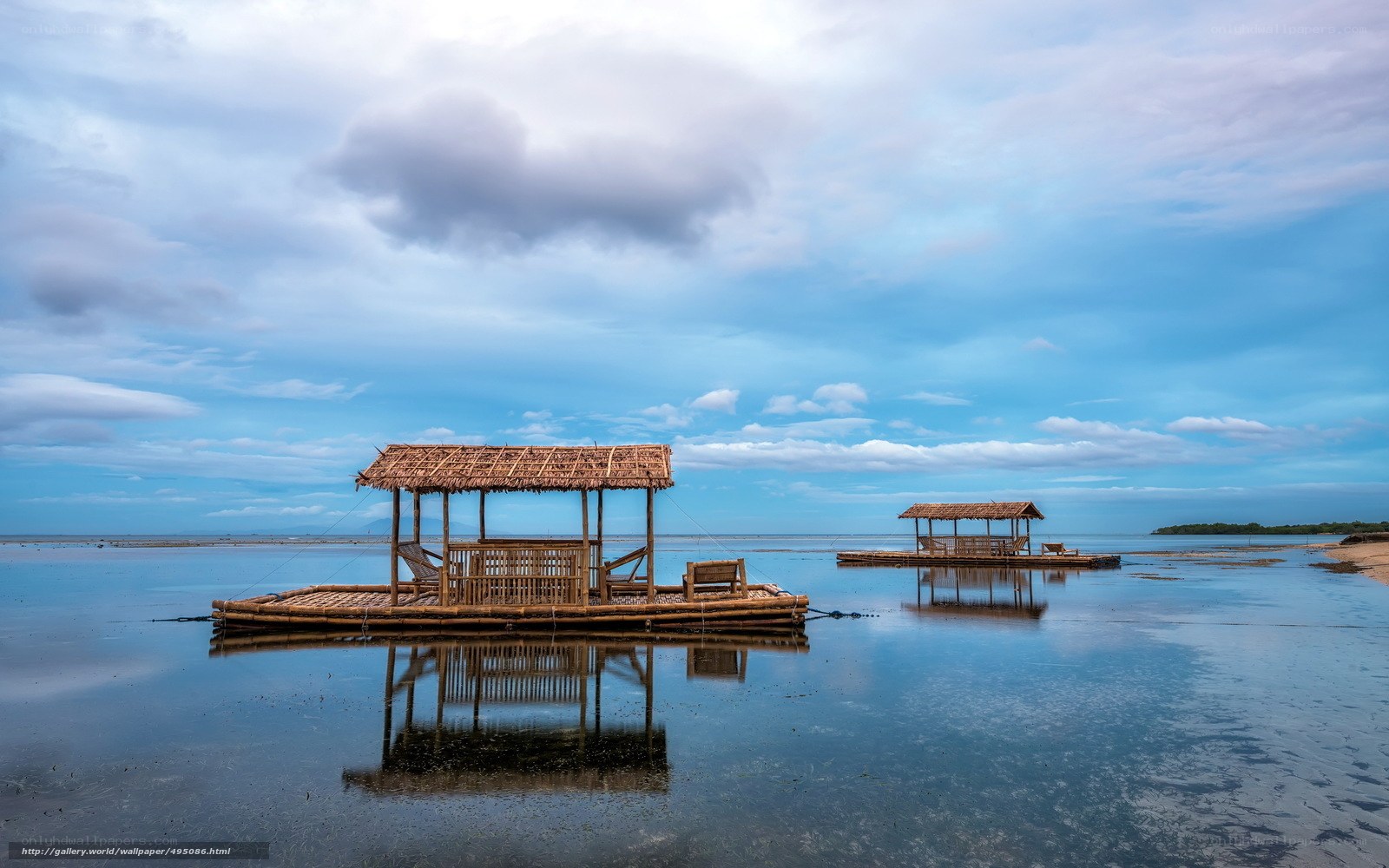 Bamboo huts on calm water