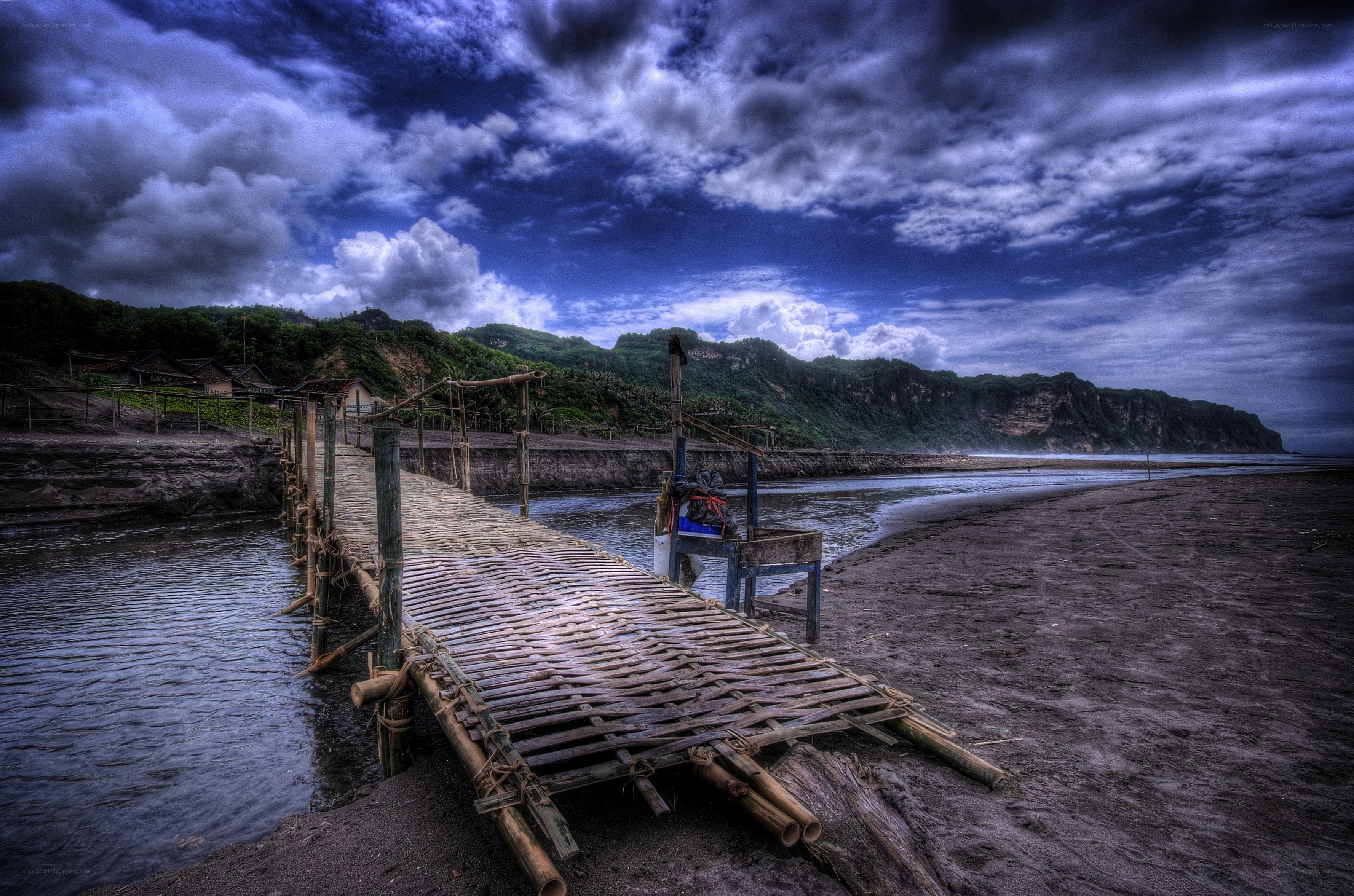 Bamboo pier on a stormy beach