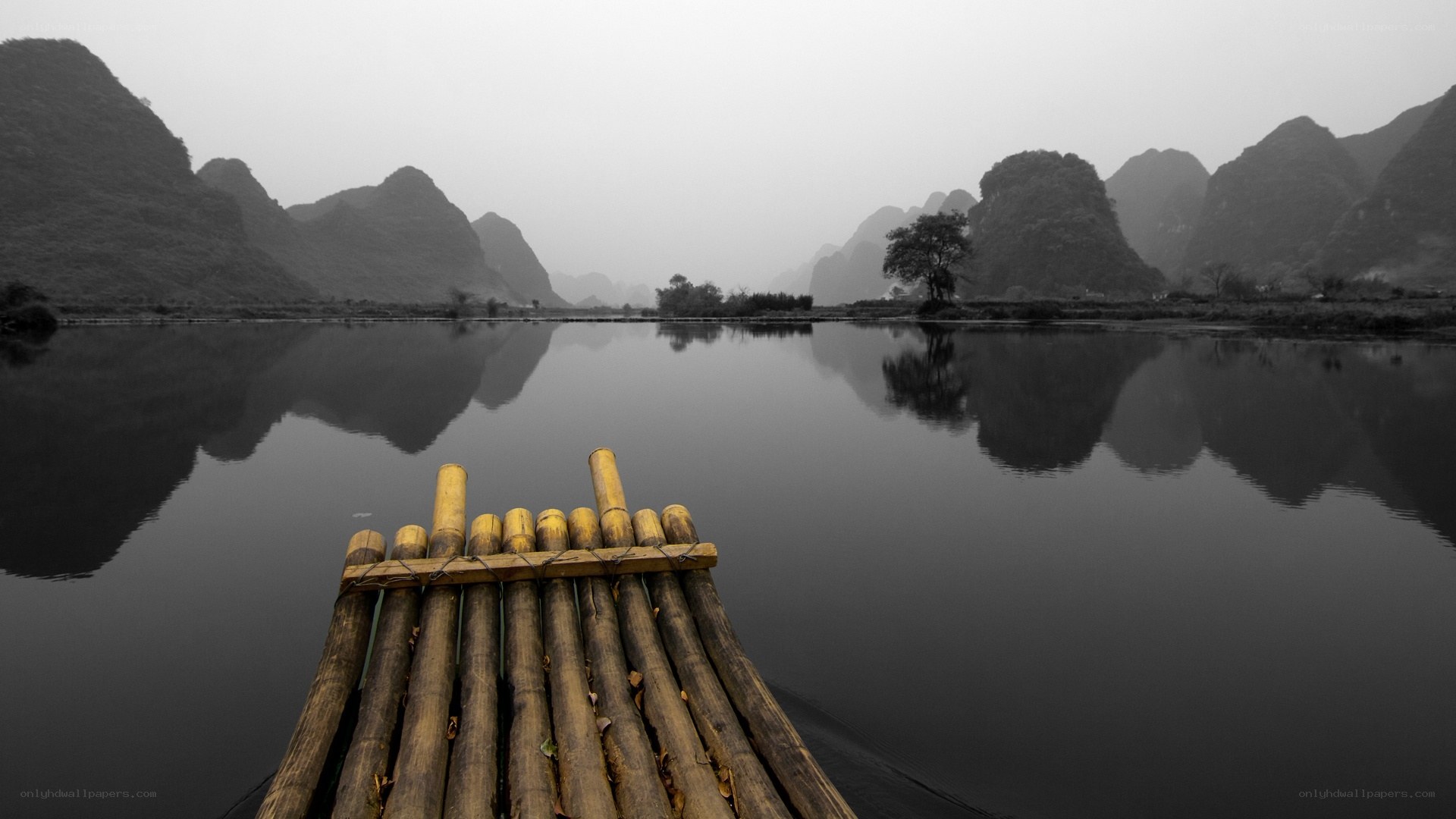 Bamboo raft on a misty river