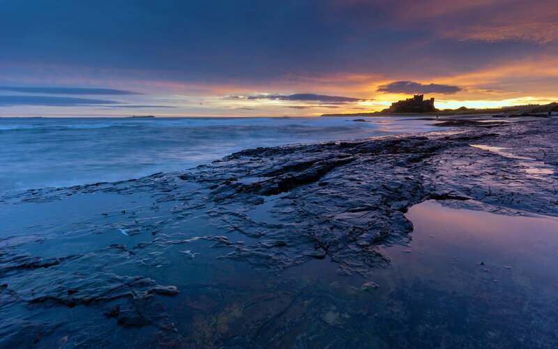 Bamburgh Castle at Sunset — Blue, Dramatic, Photograph, Ocean