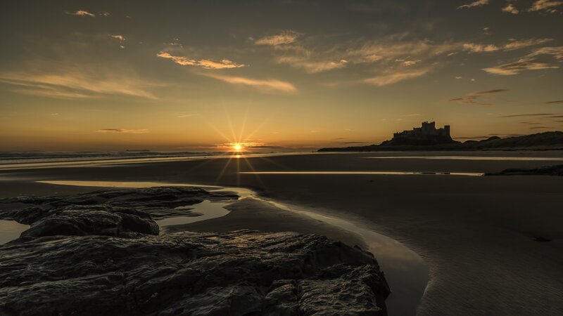 Bamburgh Castle at Sunset — Orange, Serene, Photograph