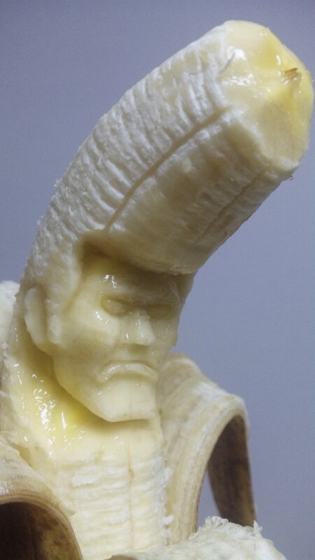 banana carved into a face