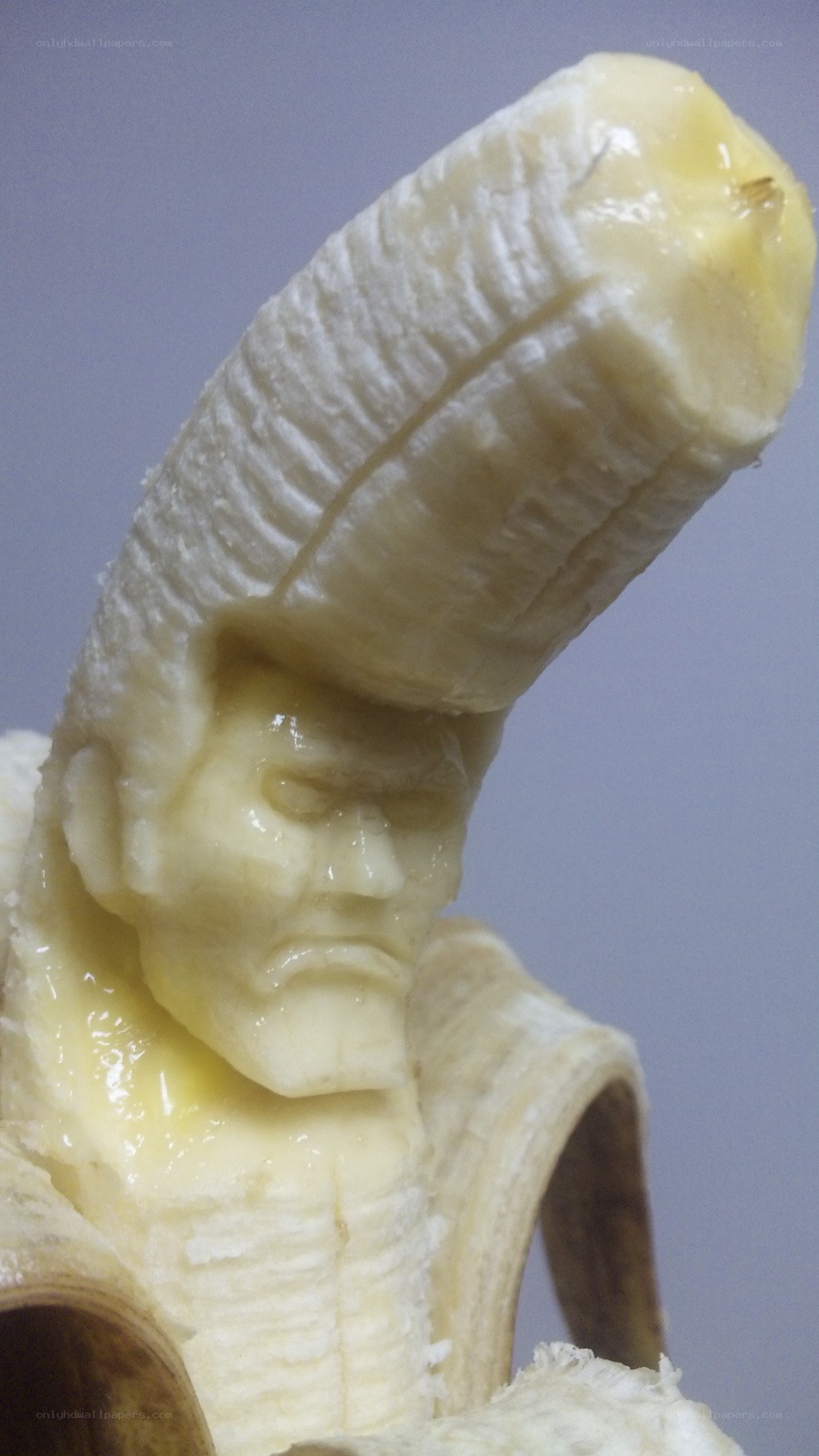 banana carved into a face