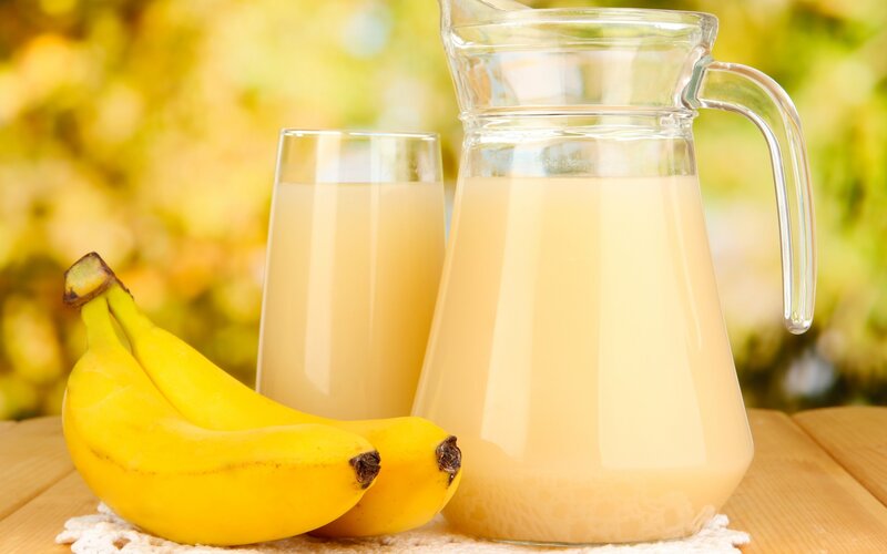 Banana juice in pitcher and glass