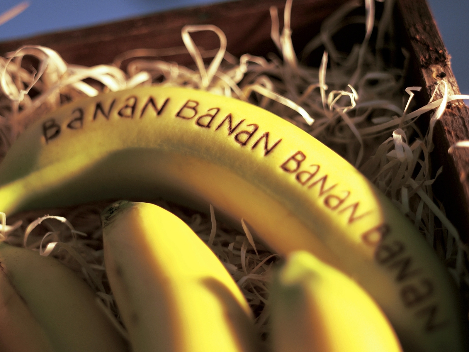 Bananas with text in a crate