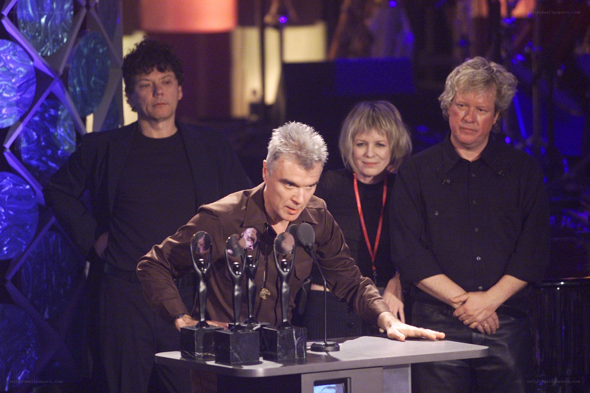 Band accepting awards on stage