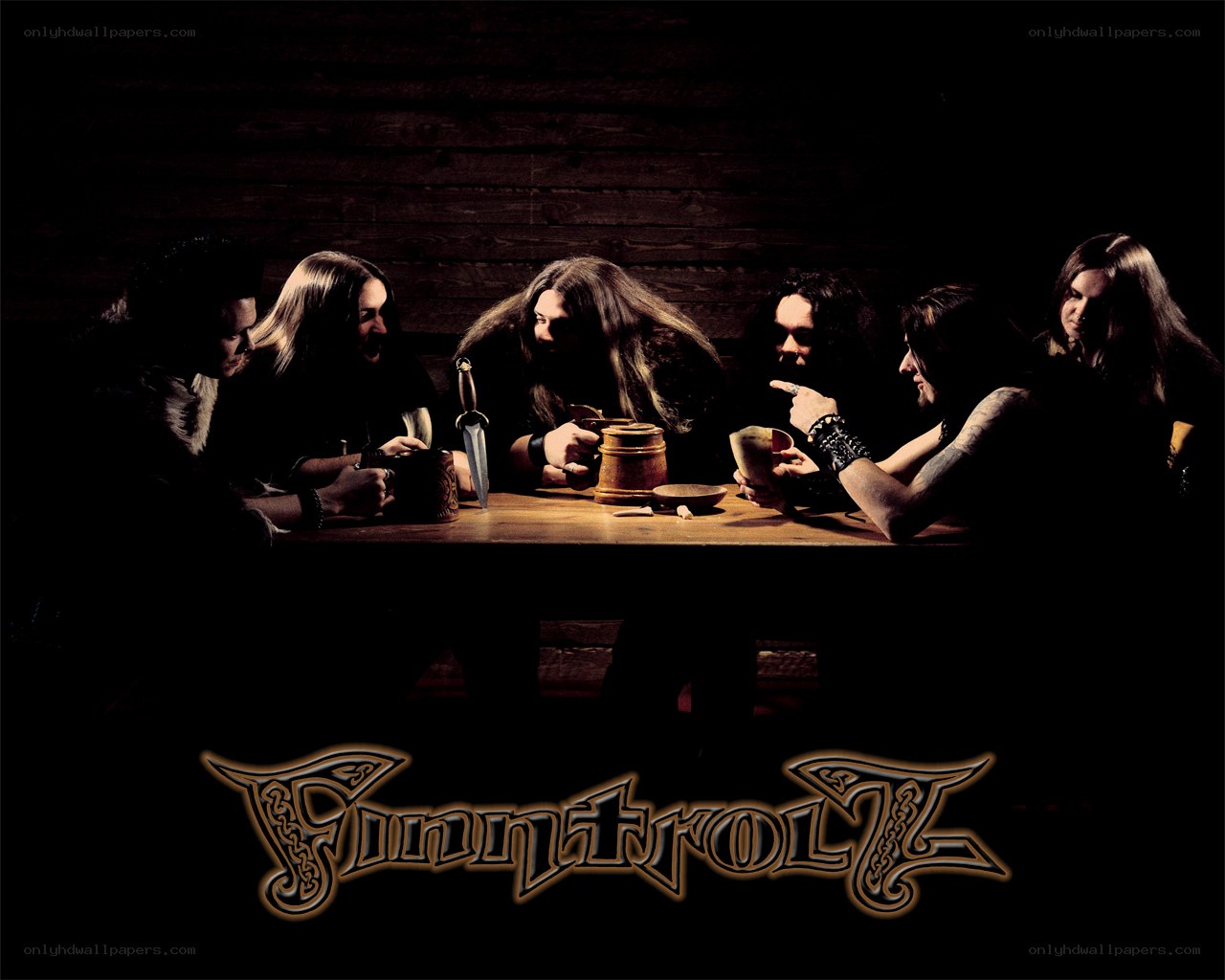 band at a wooden table