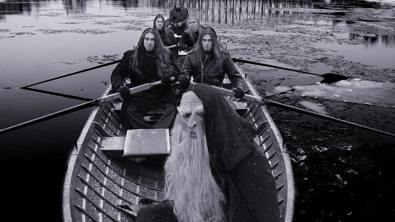 band in a boat with a hooded figure