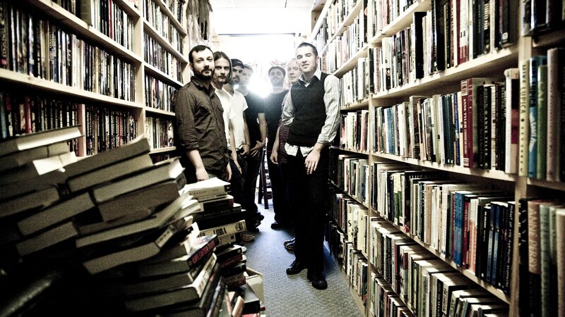 band in a bookstore aisle