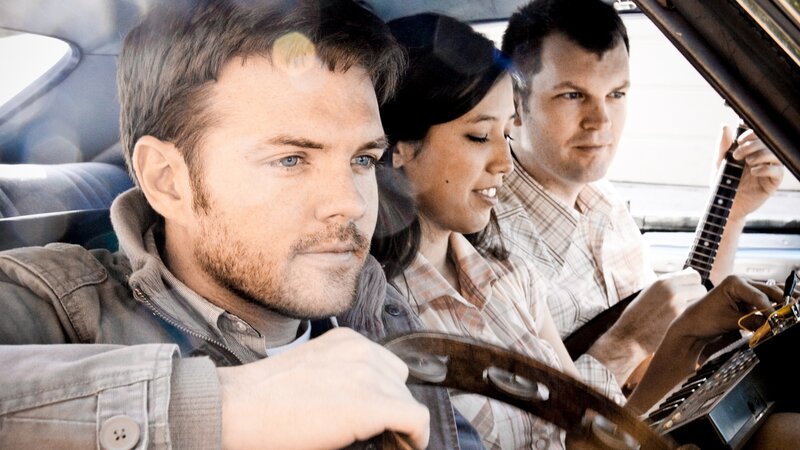 band in a car playing music