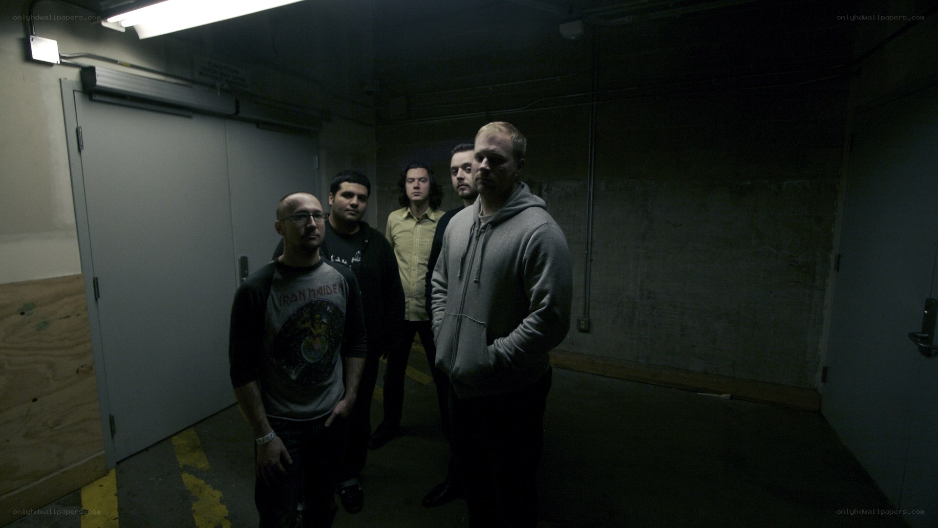 band in a dimly lit hallway