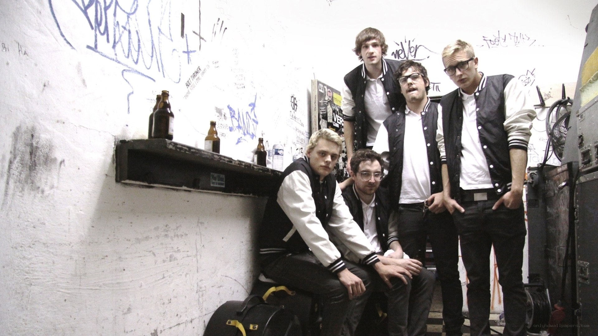 band in a graffiti room