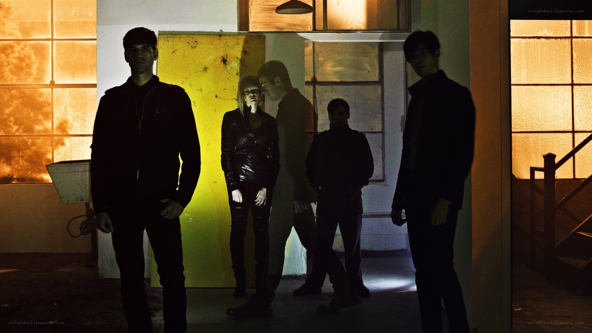 band in dimly lit room