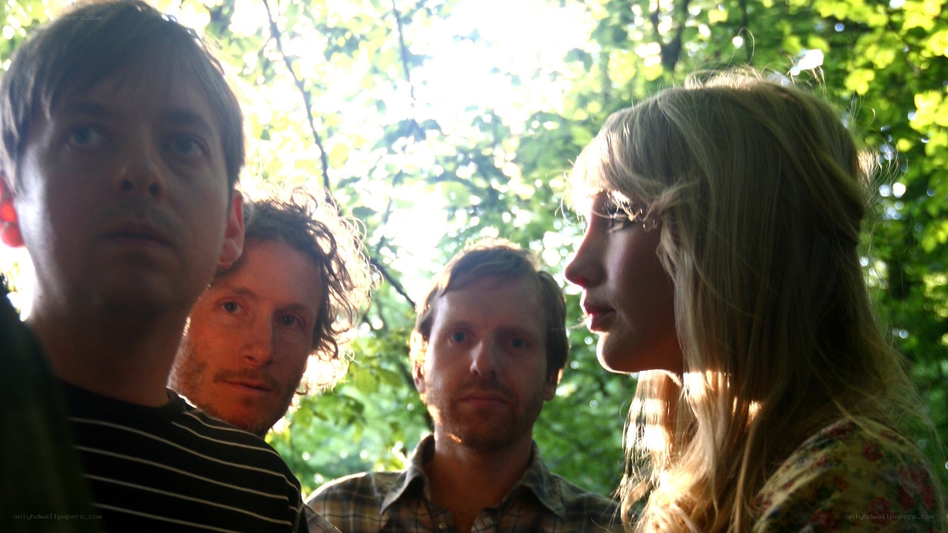 band in forest sunlight