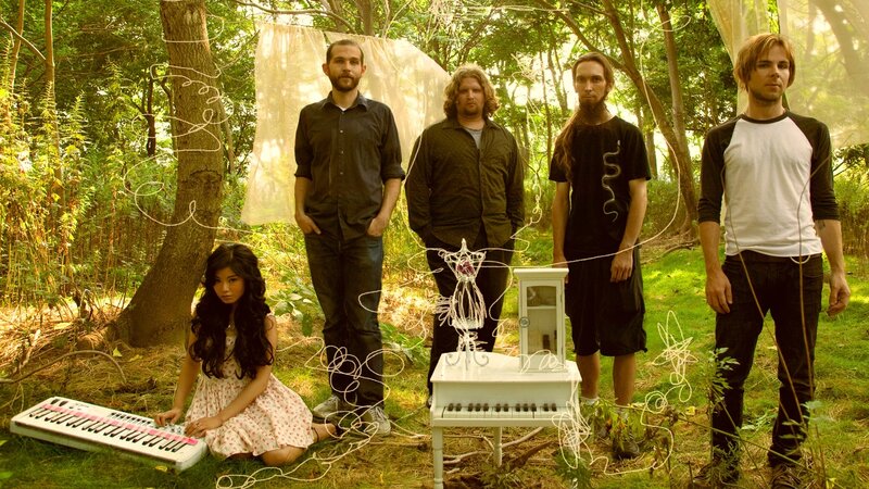 band in forest with instruments