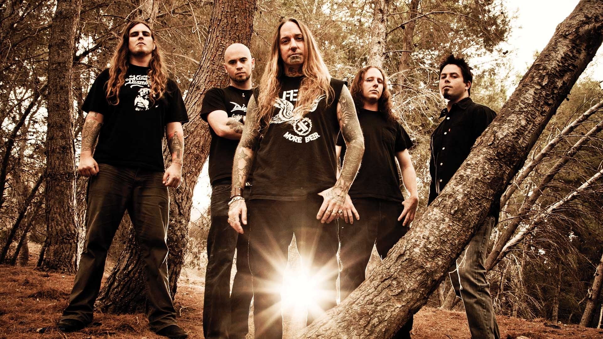 band in forest with sun flare