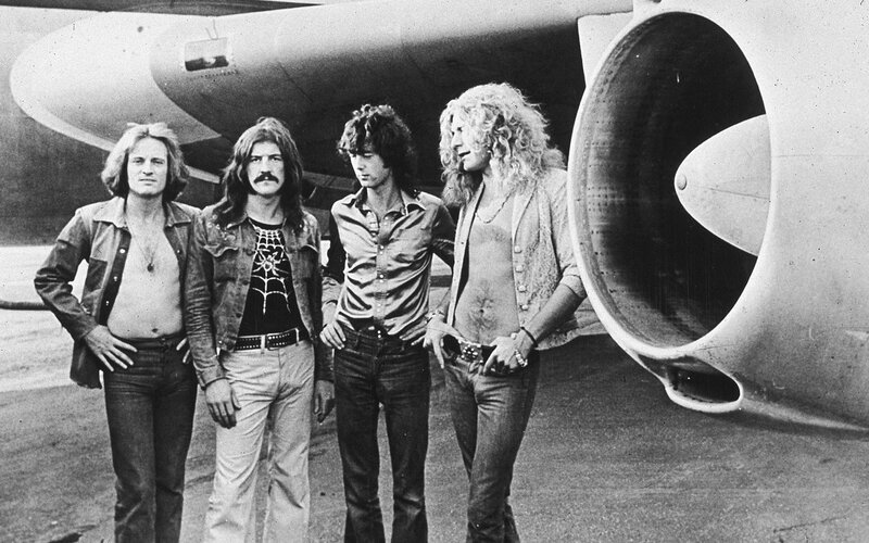 Band in front of airplane