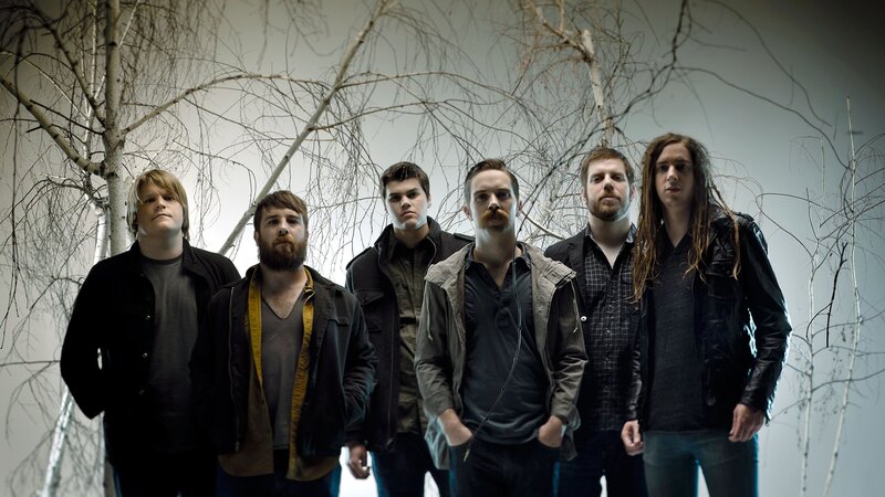 band in front of bare trees