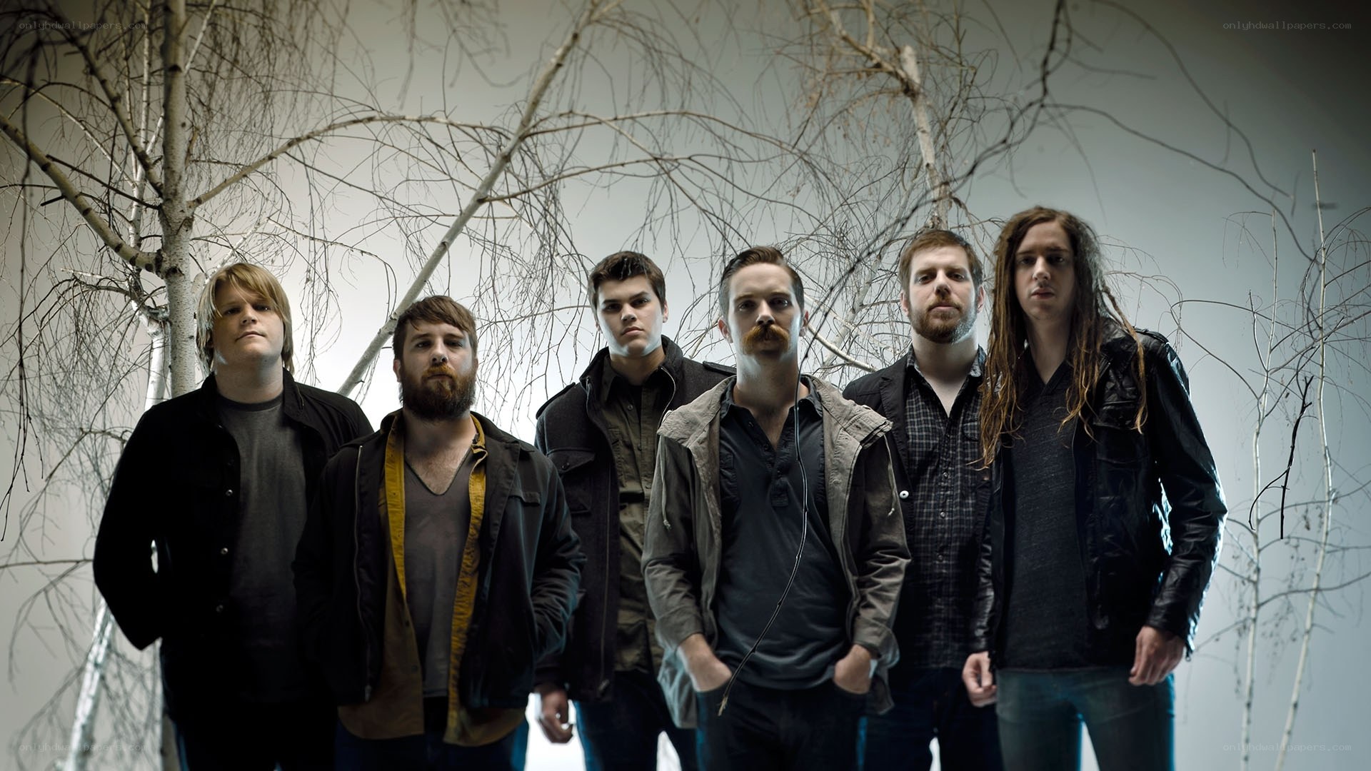 band in front of bare trees
