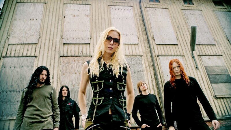 band in front of boarded building