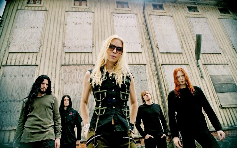 band in front of boarded building