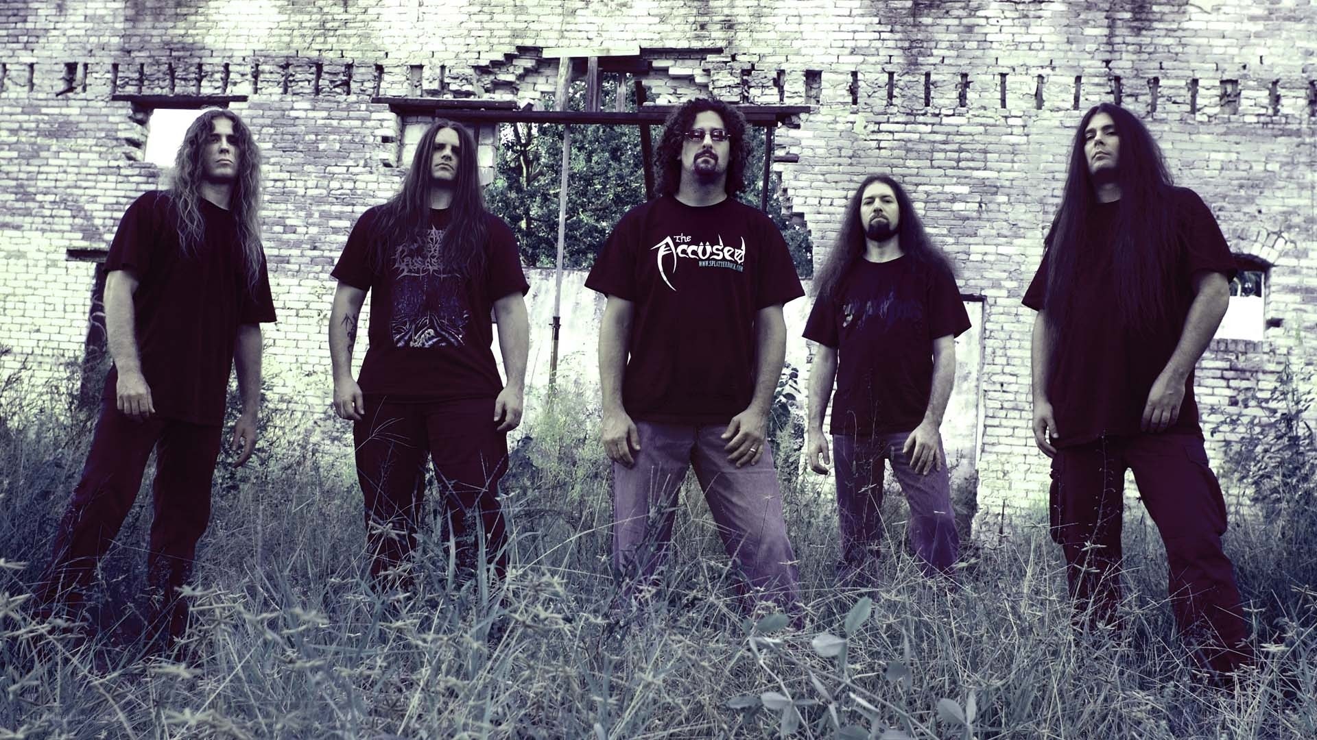 band in front of brick wall