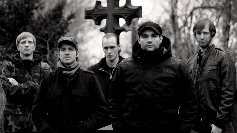 band in front of cross