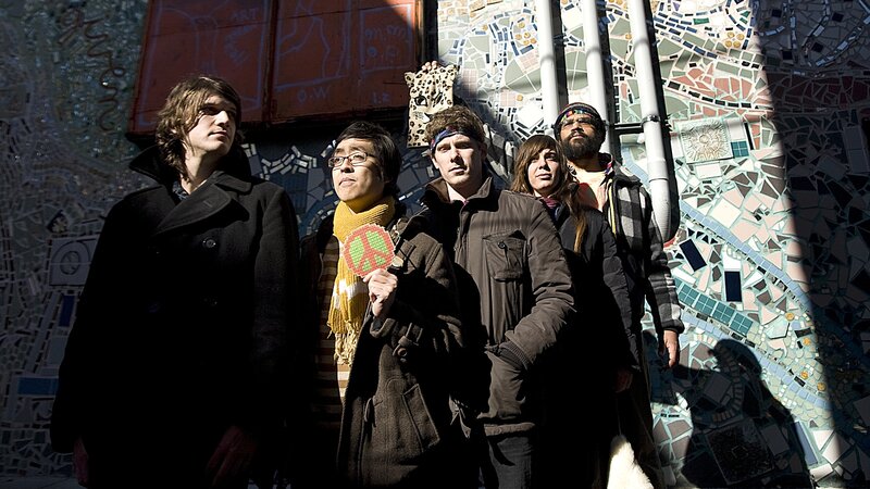 band in front of mosaic wall
